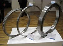 Photo: Tapered roller bearings for gearboxes (left and center) and a full complement cylindrical roller bearing (right)