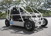 写真：「電動コミュータ用インホイールモータシステム」搭載試験車両